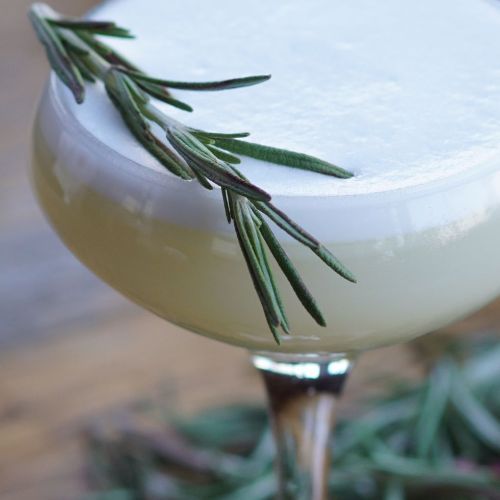 The Green Virgin cocktail made with Kitapo African Gin, garnished with fresh green herbs